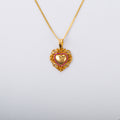 Dije en oro 18k con arabescos y rubies